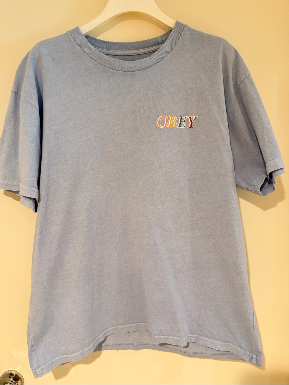 Obey Washed Light Blue Tee with Multicolor Chest Logo